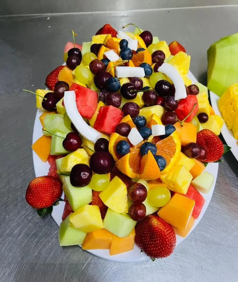 Colourful fruit skewers on bamboo sticks, ready for events